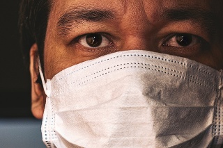 Closeup of man in mask, concept of viral infection. Theme of corona-virus epidemic.
