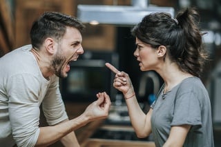 Aggressive couple arguing about their problems at home.