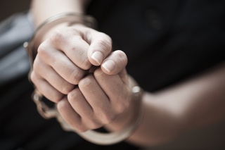 Woman in handcuffs, close-up of hands. HQLypse 2009