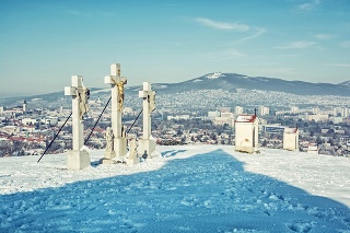 Calvary in Nitra city with Zobor hill, Slovak republic. Religious place. Winter scene. Cultural heritage. Travel destination. Snow and sunny. Blue photo filter.
