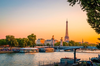 Sunset view of  Eiffel Tower, Alexander III Bridge and river Seina in Paris, France.