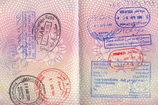 British Passport with stamps from Australia Oman, UAE, Qatar