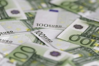 Scattered one hundred euro currency banknotes closeup