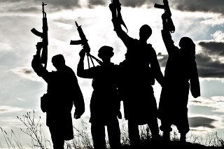 Silhouette of several muslim militants with rifles