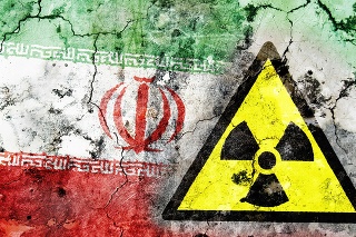 Old cracked wall with radiation warning sign and painted flag, flag of Iran