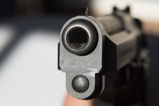 Muzzle and front sight of a 9mm pistol