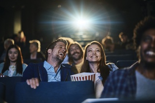 Close up of a couple enjoying a movie in the cinema