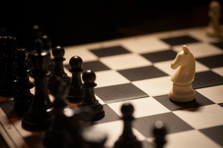 Shot of a chess board white horse moving.