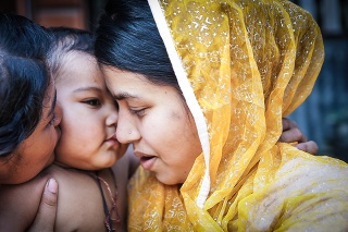 Sundrakalikapur Village, Patuakhali, Barisal, Bangladesh - 14 March, 2014: A Bangladeshi village mother with her sister is cuddling with her kid.
