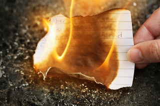 Woman burning love letter.