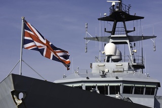 British battleship displaying its Union Jack.