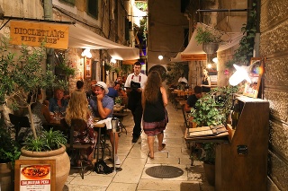 Pedestrians and customers enjoying the restaurants and nightlife of Split in Croatia