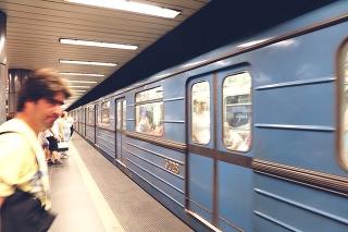 The guy on the front is making a move to ride with the train coming at subway station in Budapest, Train speeding through Budapest underground, 20 June 2017, Budapest, Hungary