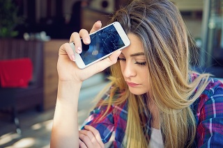Young girl is devastated after her mobile phone is fall down.