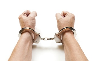 A man with handcuffs on white background.