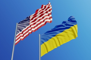 American and Ukrainian flags are waving with wind over  blue sky. Low angle view. Dispute and conflict concept. Horizontal composition with copy space.