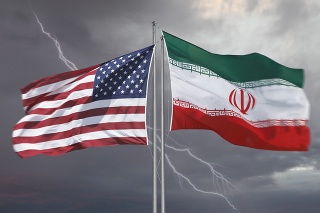 Flag of the USA and Iran with strom behind illustrating difficult relationships of these countries