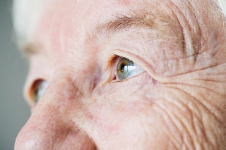 Closeup side portrait of white elderly woman's eyes
