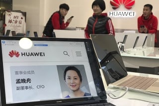 Fotka Wan-Čou v obchode značky Huawei v Pekingu.