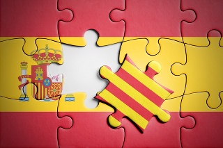 Catalan separatism in Spain concept. Puzzle with flag of Spain in background and one piece with flag of Catalonia that is outside the group of puzzles, and symbolizes the exit. Studio shot. Horizontal orientation.