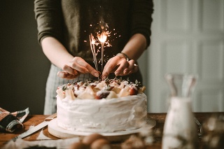 Woman making cake for celebration