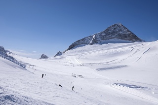 Hintertux Glacier with skiers, snowboarders, ski runs, pistes and ski lifts in Zillertal Alps in Austria