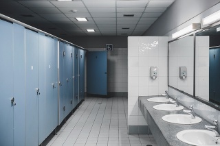 Public toilet and Bathroom interior with white urinals, Close-up of the wash bowl and chamber pot or urinal men with the stain dirty in the toilet.
