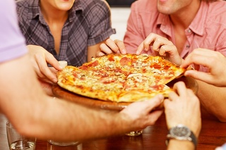 group of friends sharing a pizza..
