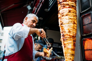 Istanbul, Turkey - October 23, 2014: Kebab seller serving a customer in the streets of Istanbul. 