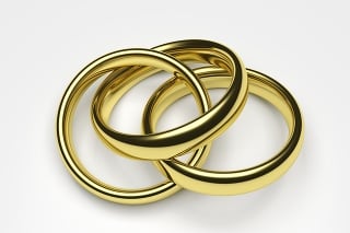 3d render illustration of a gold ring attached to two rings.