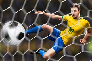 Brazilian soccer player kicks the ball on stadium