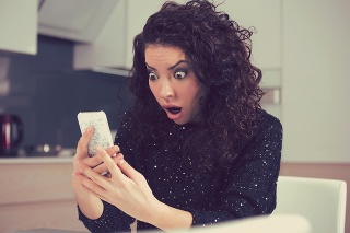 Closeup portrait funny shocked anxious woman looking at phone seeing bad photos message with scared emotion on face