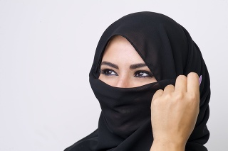 Beautiful girl wearing burqa closeup, close-up of a girl wearing burqa, arabian girl wearing burqa isolated on a grey background