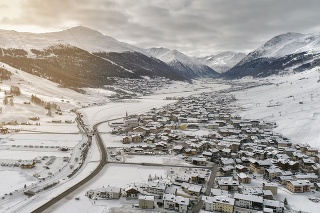 Aerial view of Livigno alps ski resort in winter, Italy. Light leak effect