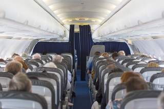 Commercial aircraft cabin with passengers