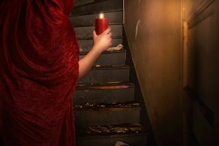 Witch in a Spooky House, Holding Candle at staircase.