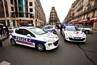 Paris, France - January 18, 2012: French Police Cars in Paris during a manifestation of the CGT (General Confederation of Labour)  against the low salaries and the lack of job. Officers and people walking around.