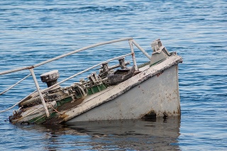 Rusty ship wreck in a blue river