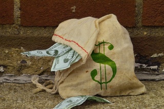 A bag of money lost in an alley.