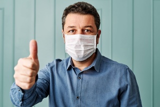 30-39 years old man wearing surgical mask.