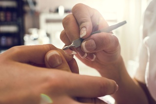 Close up women hands having manicure treatment