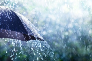 Rain On Umbrella - Weather Concept