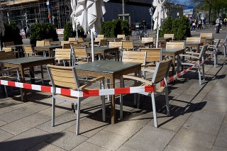Wolfsburg, Germany- 04/21/2020: stretched security tape at tables to keep social distance to slow down a spread of COVID-19 coronavirus in a store