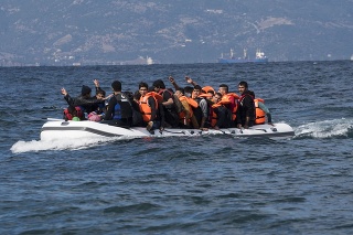 Skala Sikamineas, Lesbos, Greece - October 25, 2015: An inflatable boat filled with refugees and other migrants approaches the north coast of the Greek island of Lesbos. Turkey is visible in the background. More than 500,000 migrants have crossed from Turkey to the Greek islands so far in 2015.