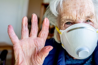 Close-Up Shot of Elderly Senior Caucasian Woman's Eyes Wearing an n95 Protective Face Mask To Prevent the Spread of COVID SARS nCoV 19 Coronavirus Swine Flu H7N9 Influenza Illness During Cold and Flu Season