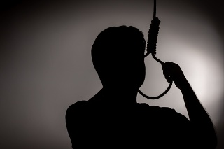 Silhouette depressed man want to commit suicide by hanging rope