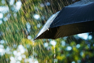 Close up of umbrella in the rain with copy space