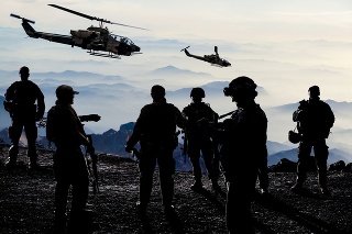 Silhouettes of soldiers during Military Mission at dusk