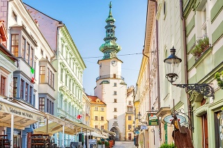 Stock photograph of an alley with stores and restaurants in old town Bratislava, Slovakia.