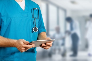 Concept of global medicine and healthcare. Doctor holds digital tablet. Diagnostics and modern technology
